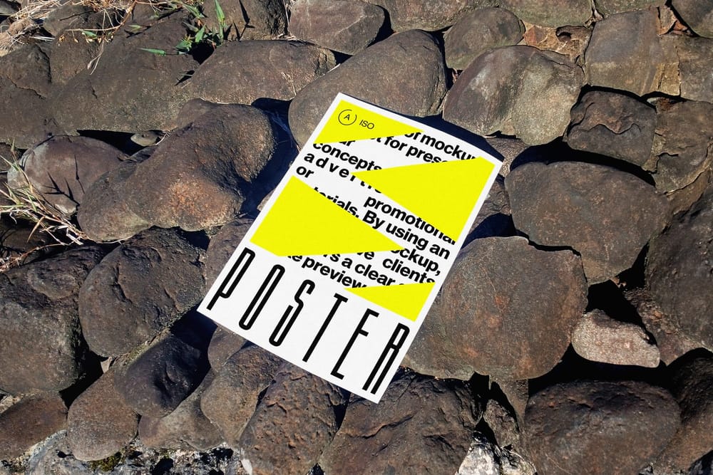 Realistic Outdoor Poster Mockup on Rocks