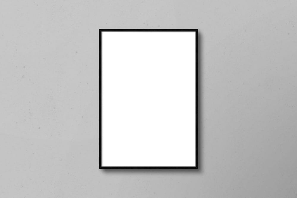 Vertical Poster Frame Mockup on Wall