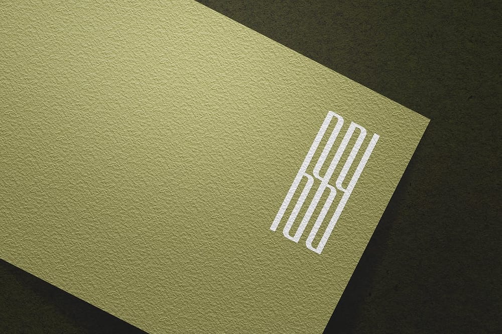 Modern Linear Logo Mockup on Rough Paper Background