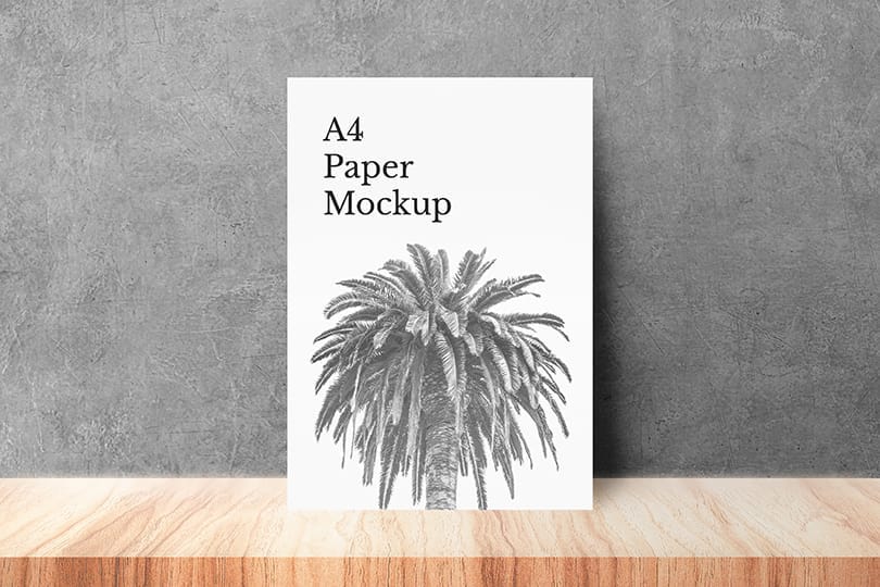A4 Paper Mockup Lean On Cement Wall Background