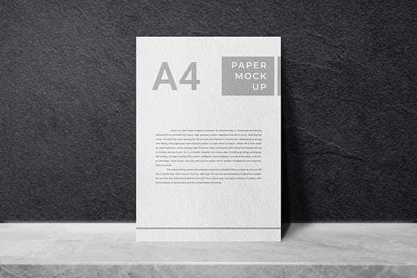 A4 Paper Mockup On Rough Black Wall Texture