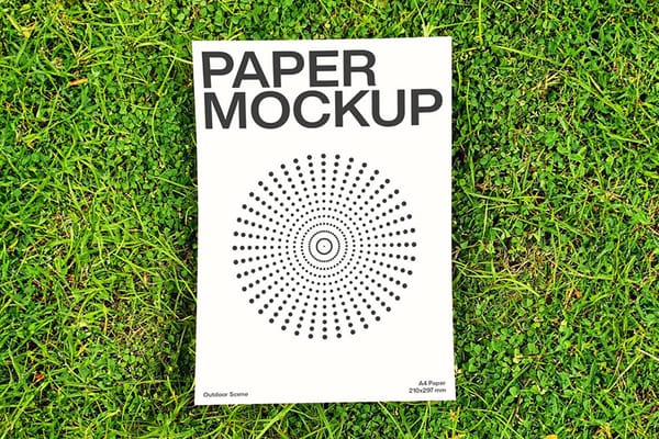 Paper Mockup Lay On Grass Ground