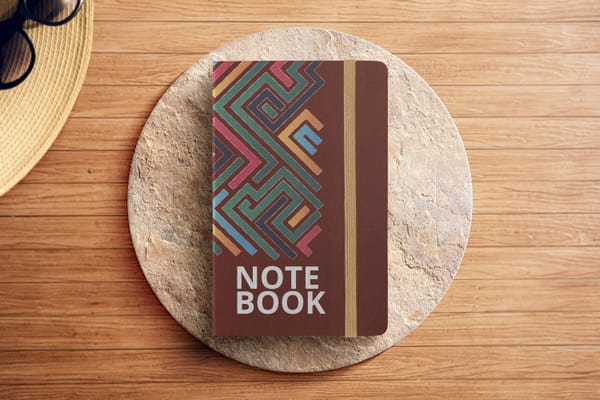 Note Book Mockup with Caput Mortuum Color on Podium Background