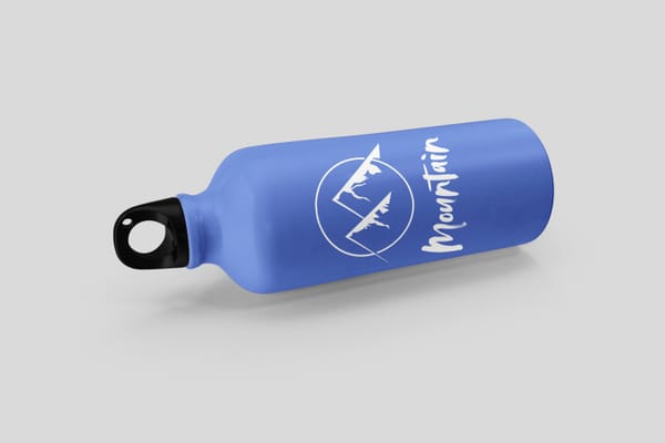 Lying Sport Bottle Mockup Blue with Mountain Graphic
