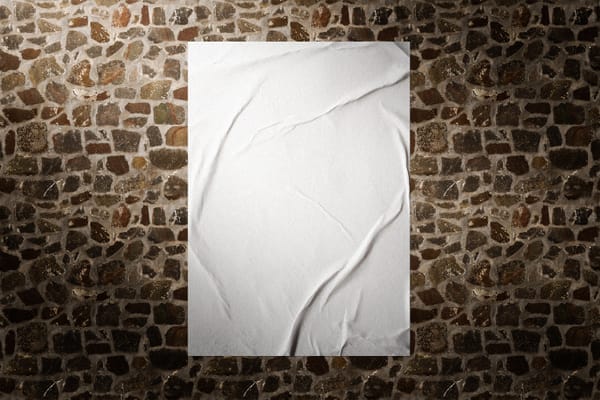 Glued Poster Mockup On Rock Wall Background